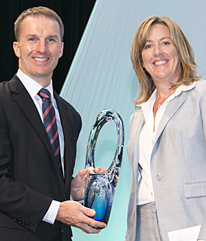 Jeff Johnson, executive director, receiving the Venue Excellence Award on behalf of the Minneapolis Convention Center. The award was sponsored by Freeman and presented by Michelle Johnson, CIO at Freeman Audio Visual Solutions.