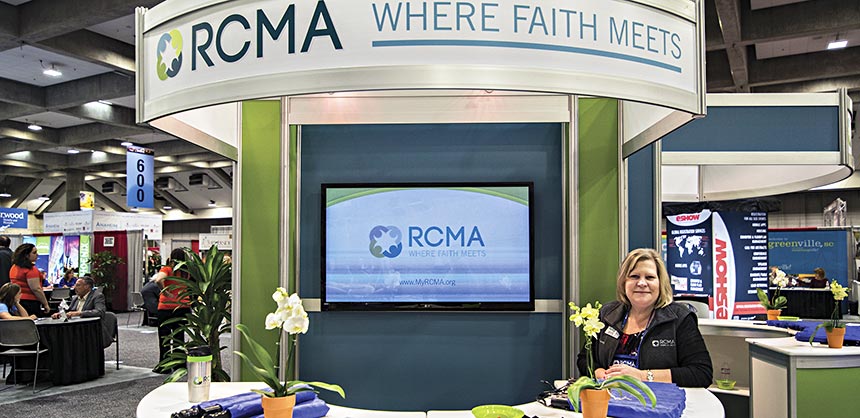 RCMA board member Debbie Mardis greets attendees in the Welcome Booth at the RCMA Emerge 2014 Conference held in Sacramento, California. Credits: RCMA