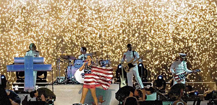 Bay Fireworks, which specializes in special effects displays for events, produced this fireworks waterfall backdrop to a high-octane Katy Perry performance for veterans.