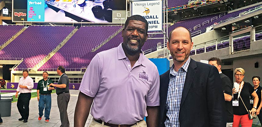 Benjamin Rabe, CEM, chats with Randall McDaniel, former offensive lineman for the Minnesota Vikings and Pro Football Hall of Fame inductee. The two met at a recent event in Minneapolis. Credit: SmithBucklin