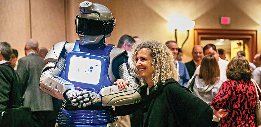 An IBM conference attendee experiences the cognitive computing power of a Watson-powered robot. Credit: IBM