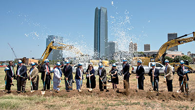 Members from the Oklahoma City Council, Oklahoma City Mayor David Holt, MAPS3 Citizens Advisory Board, MAPS3 Convention Center Subcommittee, SMG, Greater Oklahoma City Chamber and the Oklahoma City Convention & Visitors Bureau breaking ground. Credit: Oklahoma City Convention & Visitors Bureau