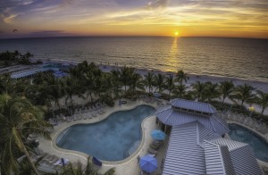 Aerial View --- Beachside Pool Complex and Beach (Orange Sunset) --- The Naples Beach Hotel & Golf Club