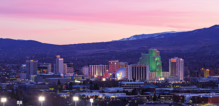 RENO, NEVADA, UNITED STATES - Jan 22, 2020: Reno, Nevada - January 2020: A colorful sunset over downtown Reno, Nevada and its downtown casino towers.
