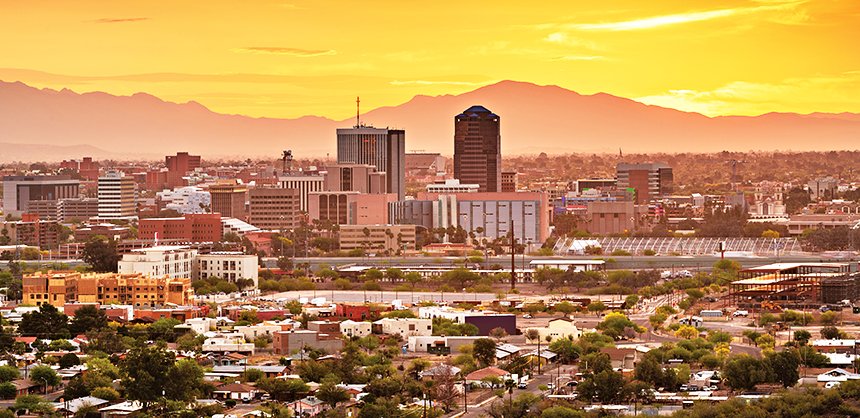 Tucson, Arizona, USA downtown city skyline with mountains at twilight.