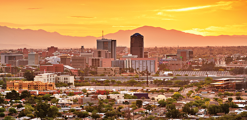 Tucson, Arizona, USA downtown city skyline with mountains at twilight.