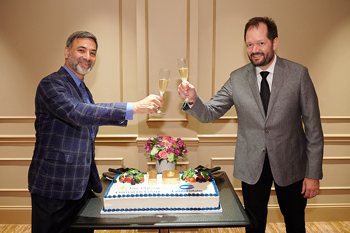 Convention Center President Michael Sawaya and Steve Pangburn, Chief-Executive Officer of Centerplate-Sodexo Sports-Leisure share a toast.