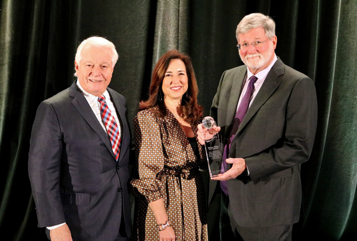 Roger Dow, president and CEO, U.S. Travel Association (left), and Christine Duffy, president, Carnival Cruise Line and national chair, U.S. Travel Association (center), presented Miles with the award. 
