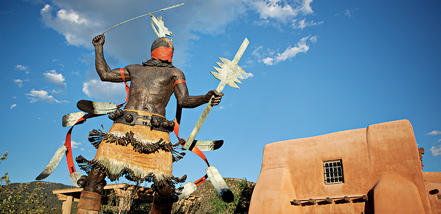 The “Apache Mountain Spirit Dancer” welcomes visitors to the Museum of Indian Arts and Culture in Santa Fe, New Mexico. Photo by Brenda Kelley