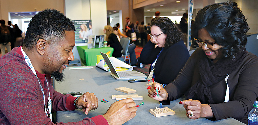 Attendees at the most recent American Public Health Association annual meeting also have a bit of fun while playing brain-teaser games.  EZ Event Photography