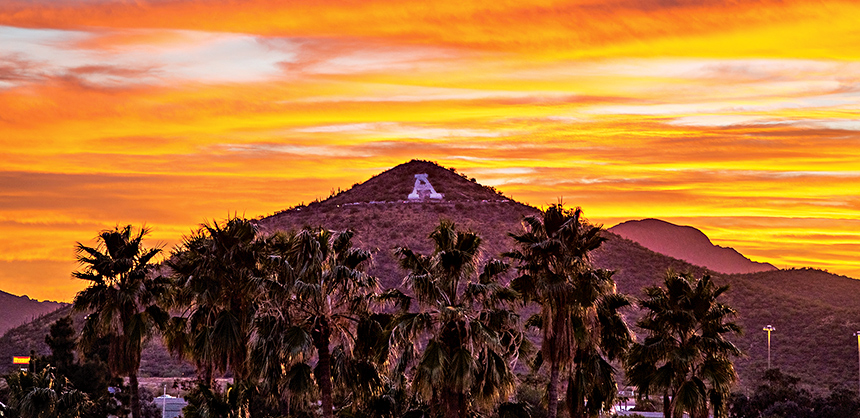 The stylized “A“ on Sentinel Peak, below, pays homage to the University of Arizona. Visit Tucson