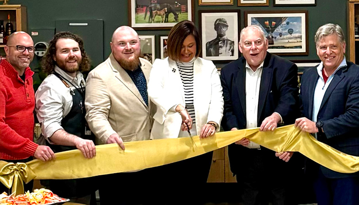 Pictured from L to R: Michael Scott, Project Manager, Solid Light (design firm); Sam Newton, Airport Welcome Center Manager, Louisville Tourism; Mike Attebury, Visitor Information Center Manager, Louisville Tourism; Nicole Twigg, Vice President of Tourism Development, Louisville Tourism; Doug Bennett, Executive Vice President, Louisville Tourism; Dan Mann, Executive Director, Louisville Muhammad Ali International Airport. Courtesy photo.