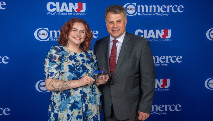 Donna Cashin of Next Level Performance accepts the 2024 Company that Cares Award from Anthony Russo, President of the CIANJ, at the annual awards celebration.