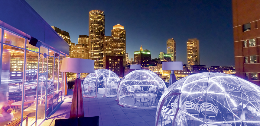 The Envoy Hotel in Boston, MA offers heated igloos accommodating 10 people on their rooftop.