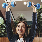 Happy Office Workers Working with Dumbbells