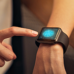 Woman touching and scanning fingerprint on smart watch to unlock, Concept digital security and private data access in technology.