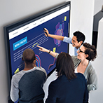 Business people communicating over board in office